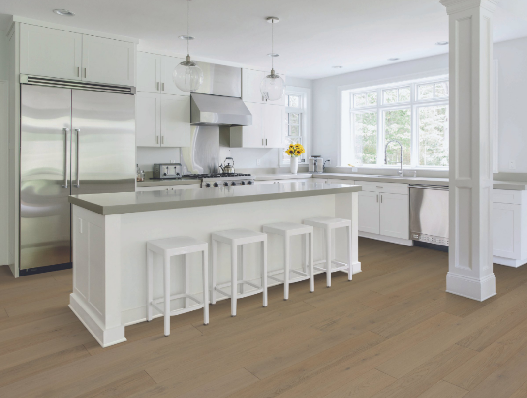 Mirror Lake Laminate in bright, clean kitchen with white cabinetry, granite island, and stainless steel fridge